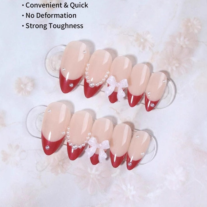 Artificial nail set with glamorous rhinestone and bow decorations Stornfield