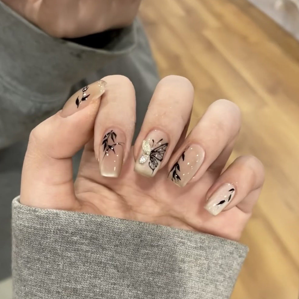Artificial nail extensions with floral butterfly design Stornfield