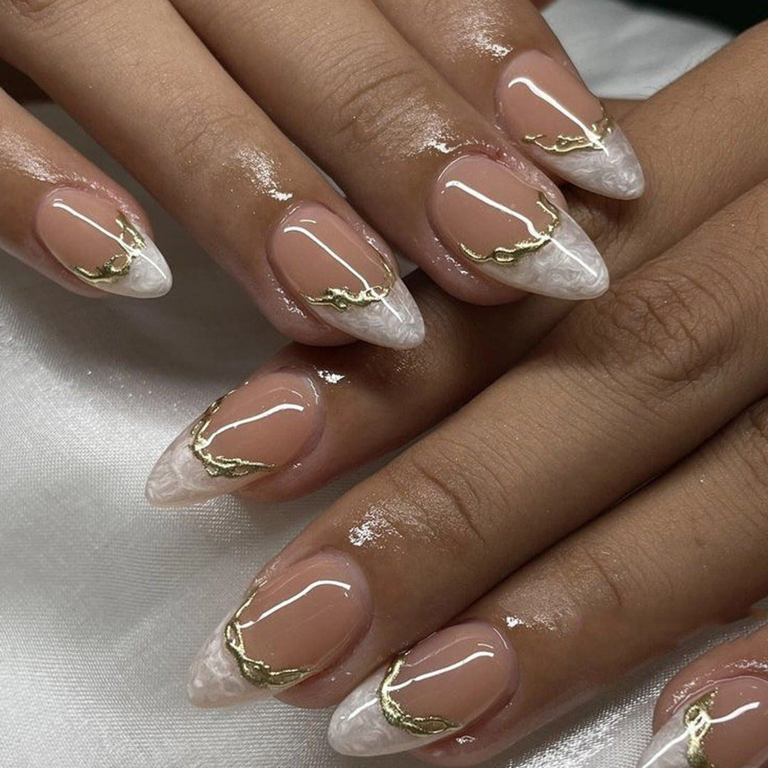 Artful Stiletto Nails with Golden Accents Stornfield