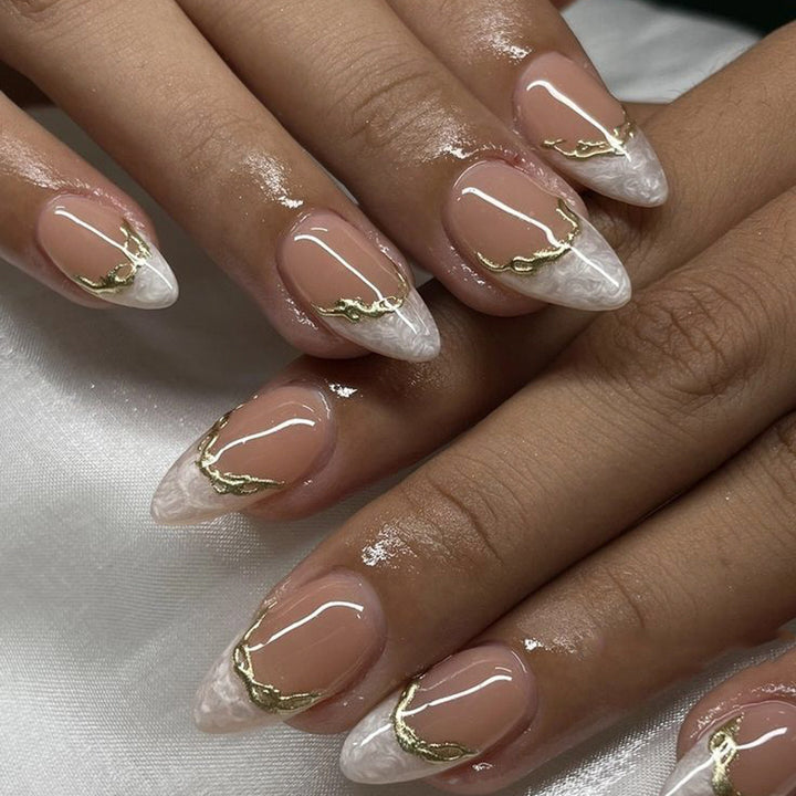 Artful Stiletto Nails with Golden Accents Stornfield