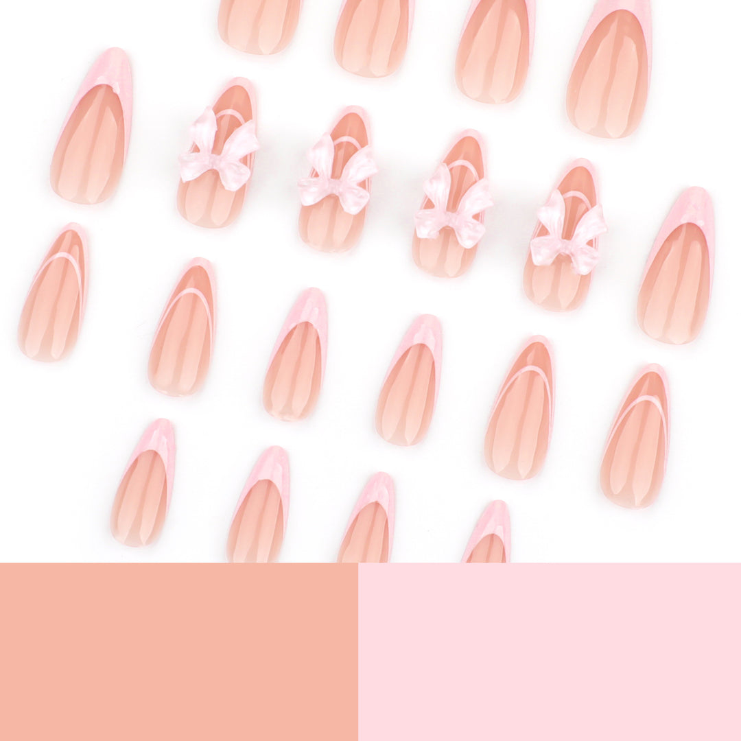 Artistic Nail Extensions with Transparent Bow Accents Stornfield