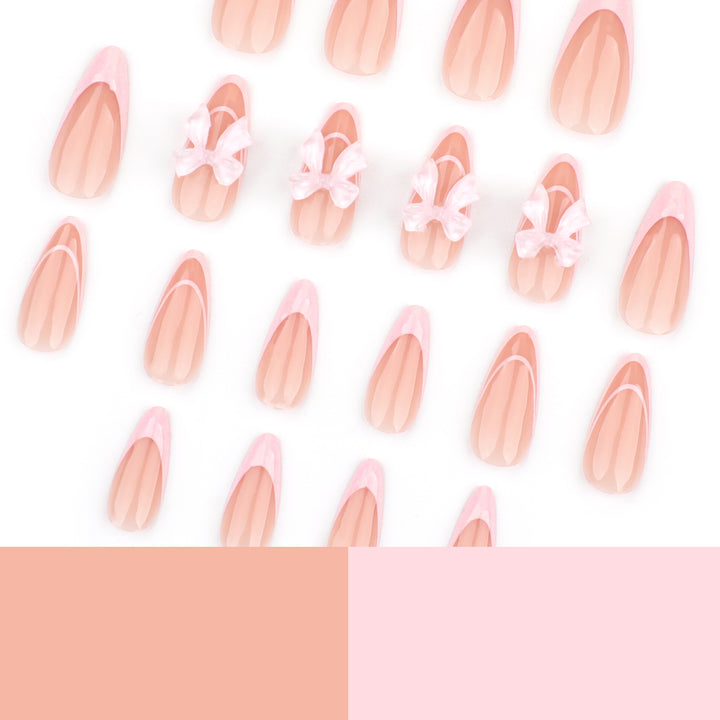 Artistic Nail Extensions with Transparent Bow Accents Stornfield