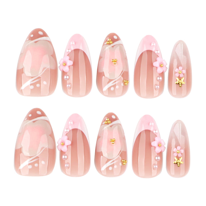 Artful nail extensions with floral patterns and glitter accents Stornfield