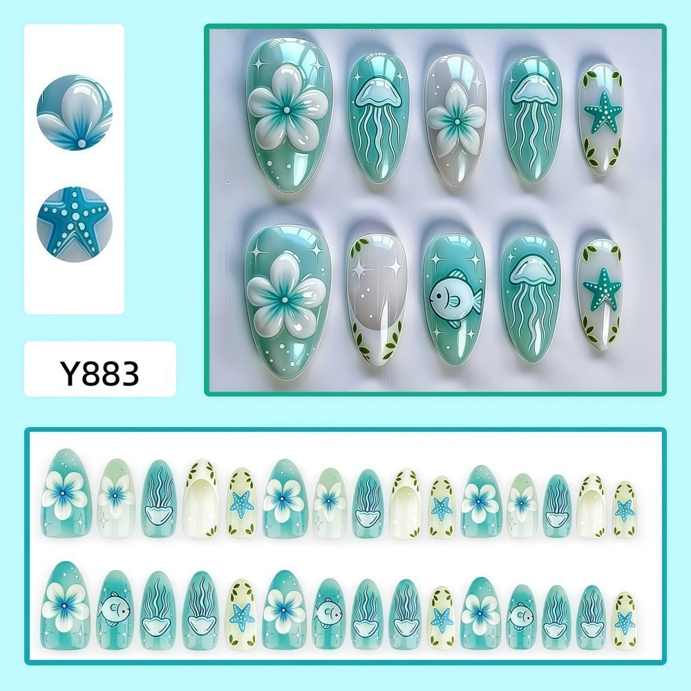 Artificial nails in a maritime design with colorful shell and water motifs Stornfield