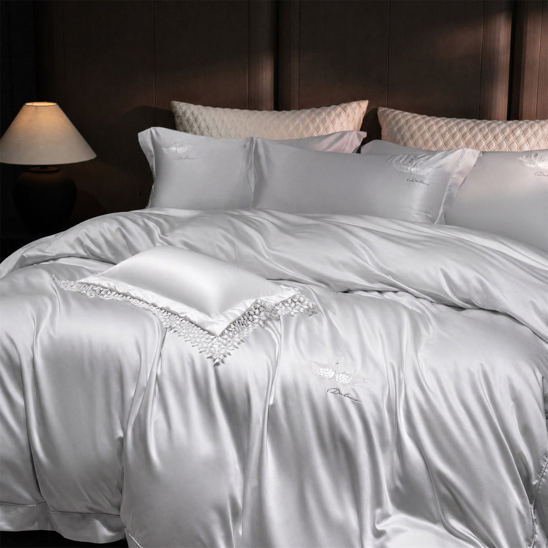 Luxurious satin bedding set with embroidered swan motif and lace pillow