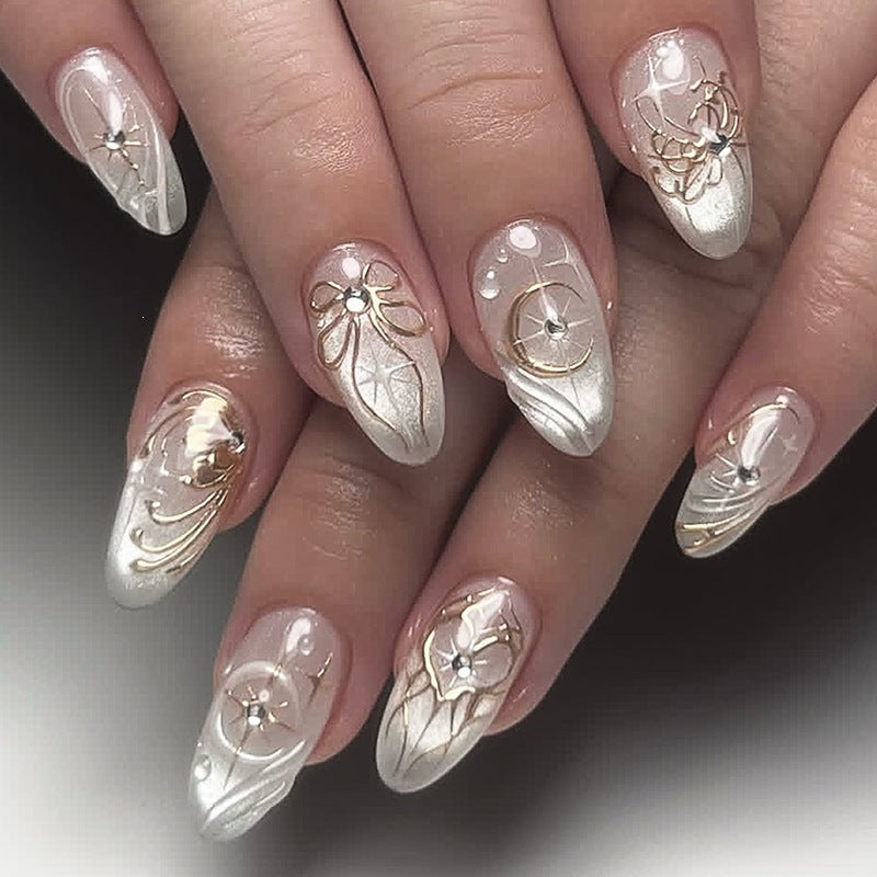 Acrylic nail set with elegant embellishments and glitter accents Stornfield