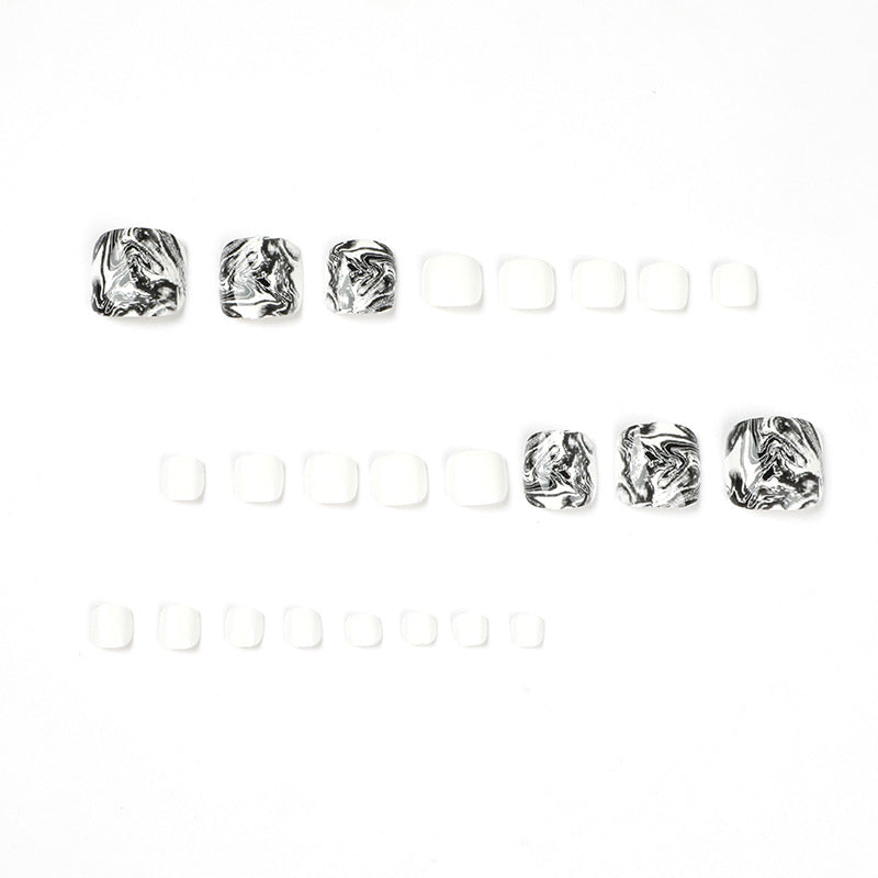 Artful toenail art in elegant marble design Stornfield