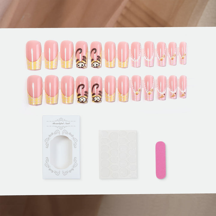Artificial nail set with playful animal motifs and elegant embellishments Stornfield