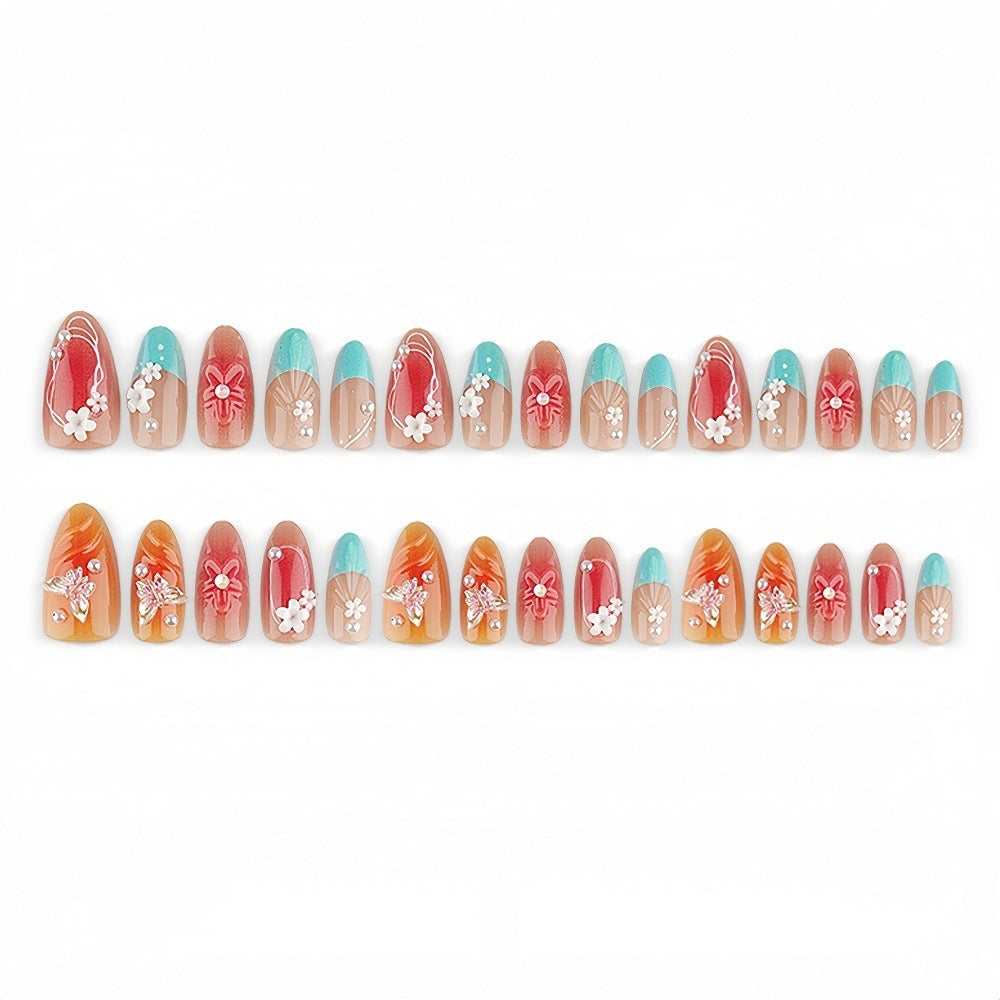 Artificial nail set with floral accents and glittering 3D applications Stornfield