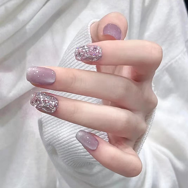 Artificial nail set with glitter and metallic effects Stornfield