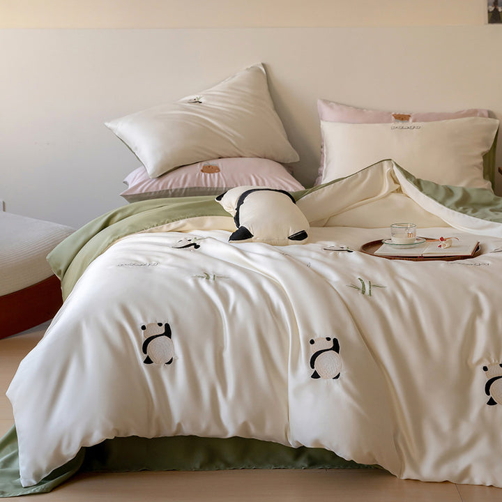 Bedding set with embroidered hot air balloon motifs and silky satin finish