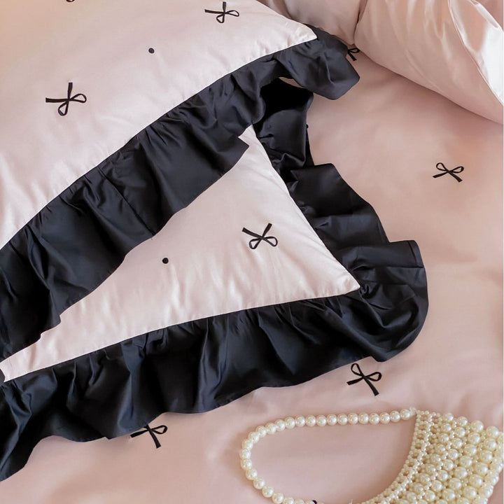 Reversible cotton satin bedding set with fine bow embroidery and ruffled edge
