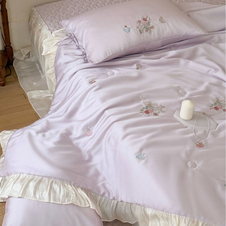 Romantic satin bedding set with ruffle, floral embroidery and tie pillow