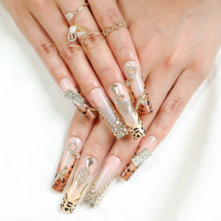 Acrylic nail set with luxurious glitter and animal motifs Stornfield