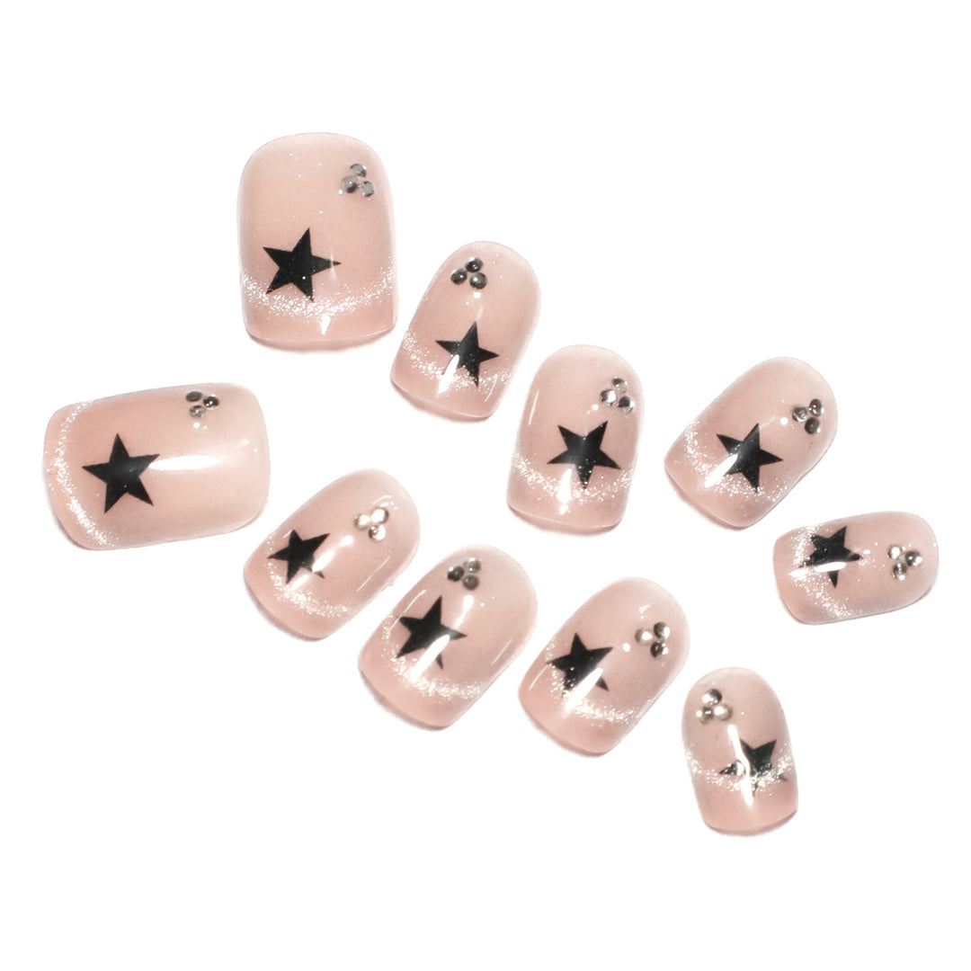 Artistic acrylic nails with glamorous star motifs Stornfield