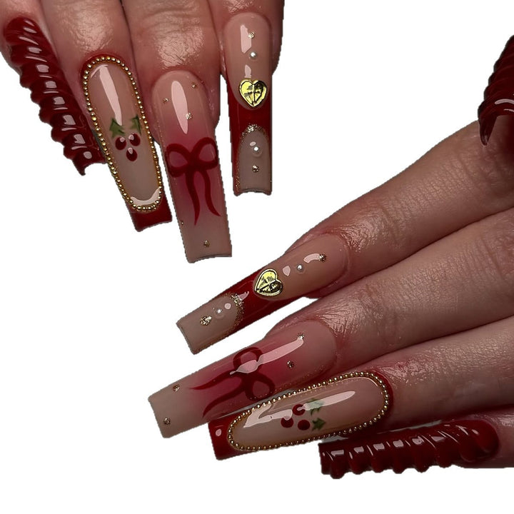 Artificial nail set with festive accents and glitter embellishments Stornfield