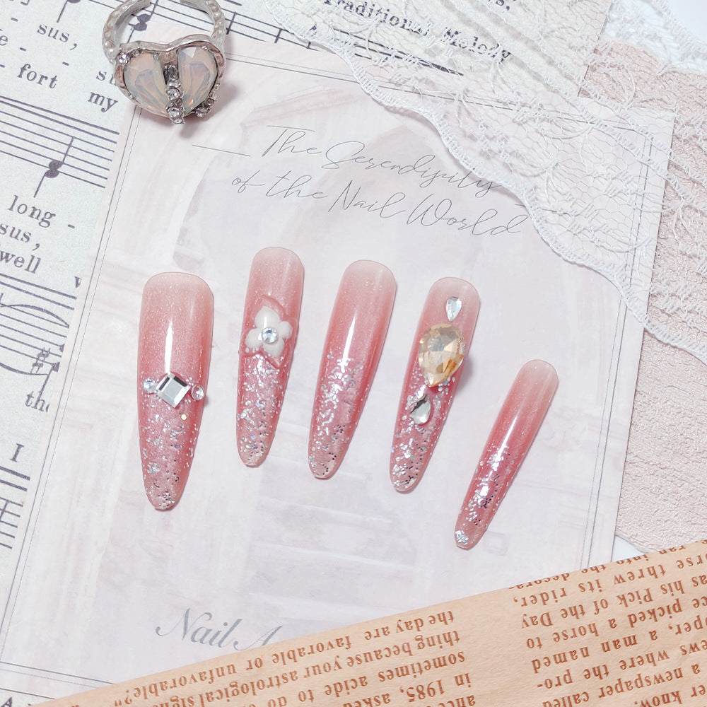 Shiny artificial nails with rhinestones and glitter Stornfield