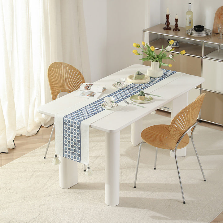 Web table runner made of cotton blend with woven diamond design and tassels