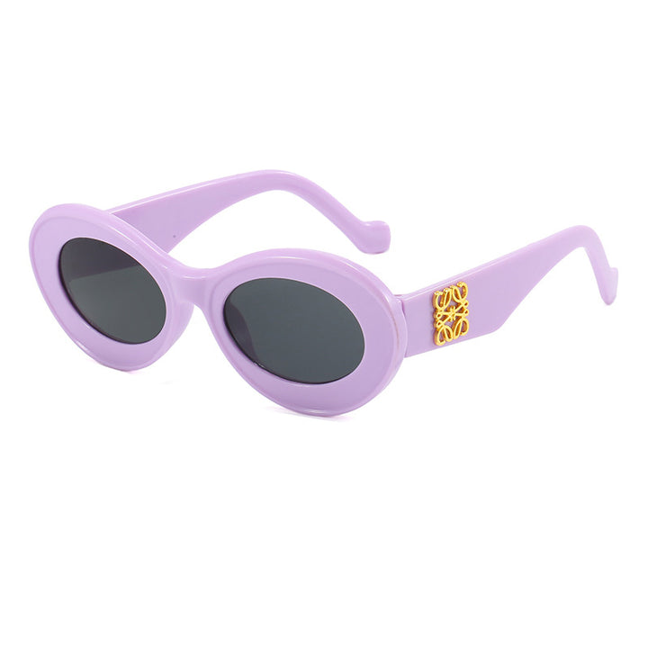 Women's fashionable sunglasses with oval frame and golden applications Stornfield