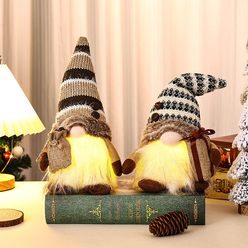 Decorative Christmas gnome with gift package Stornfield