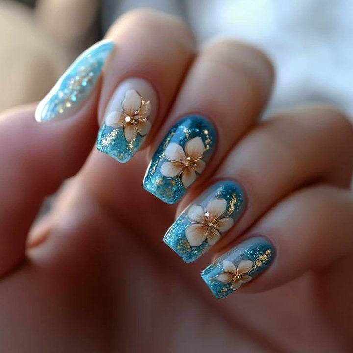 Artificial nail tips with floral accents and glitter Stornfield