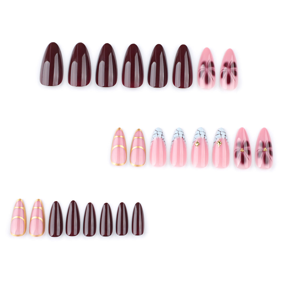 Artful Stiletto nails with gold accents and decorative floral designs Stornfield