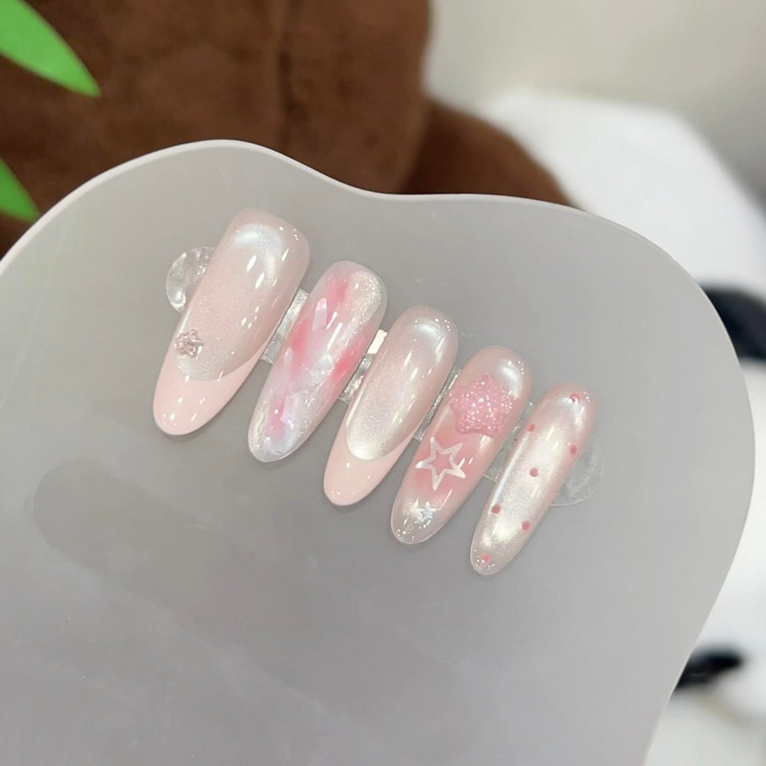 Artificial nails with delicate glitter and star motifs Stornfield