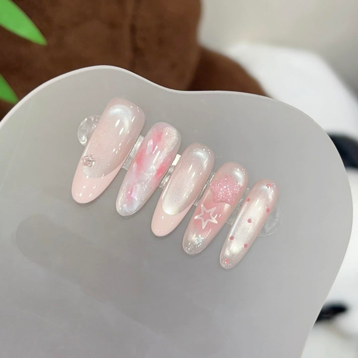 Artificial nails with delicate glitter and star motifs Stornfield