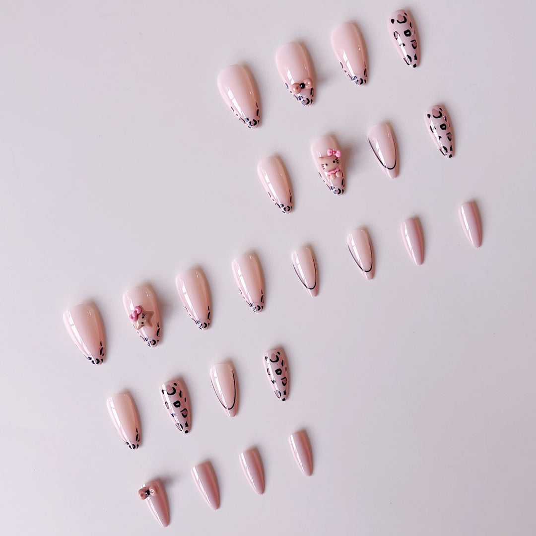 Artificial nail set with playful animal motifs and glitter accents Stornfield