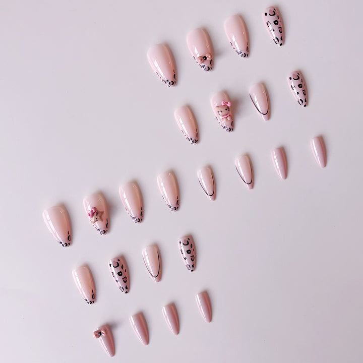 Artificial nail set with playful animal motifs and glitter accents Stornfield