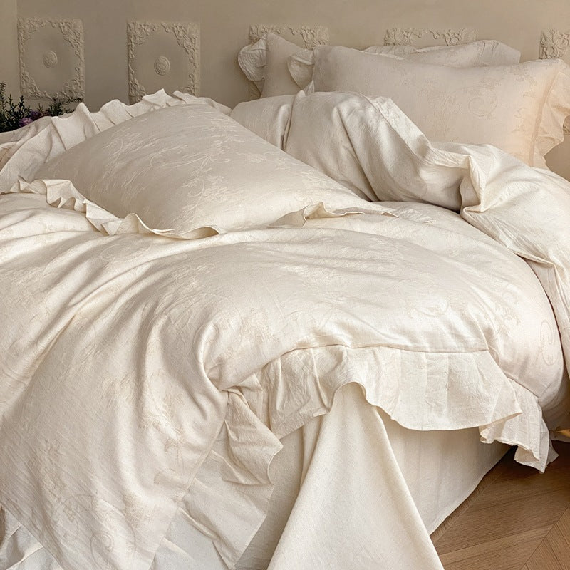 Jacquard bedding set with decorative ruffle border and floral relief