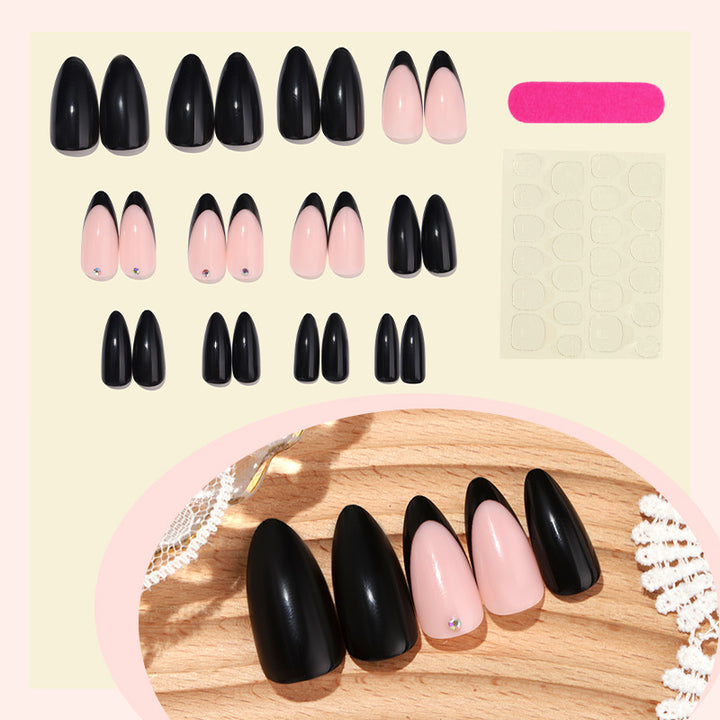 Acrylic nail set with elegant black-pink design and rhinestone-embellished accents Stornfield