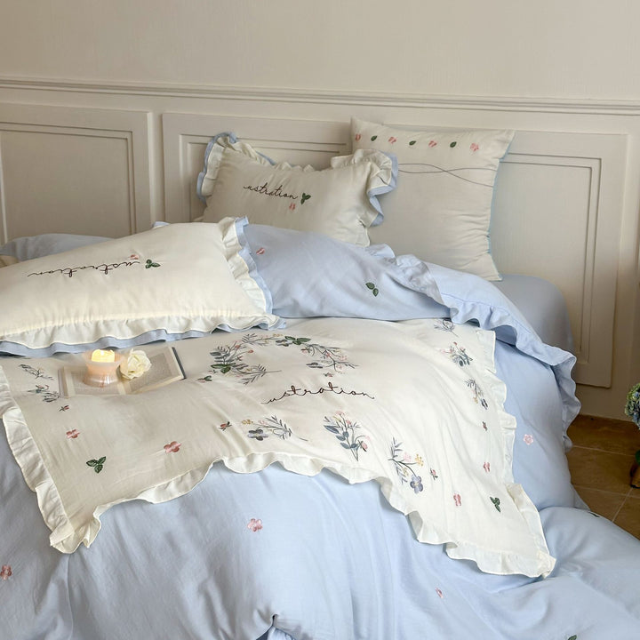 Cotton bedding set in country house style with ruffle edge and fine floral embroidery Stornfield
