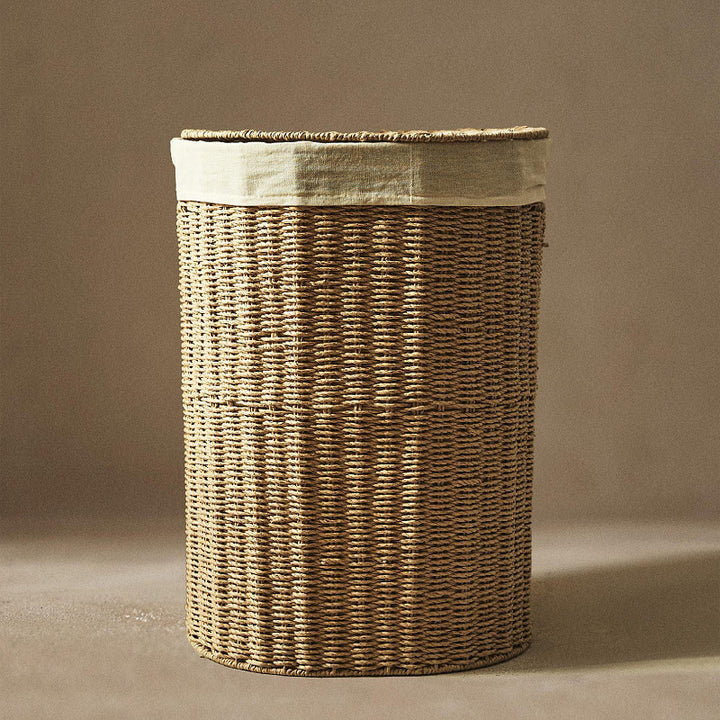 Round laundry basket made of natural materials Stornfield