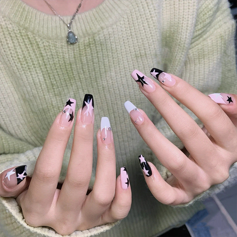 Artificial nail set with glamorous star design and sparkling accents Stornfield