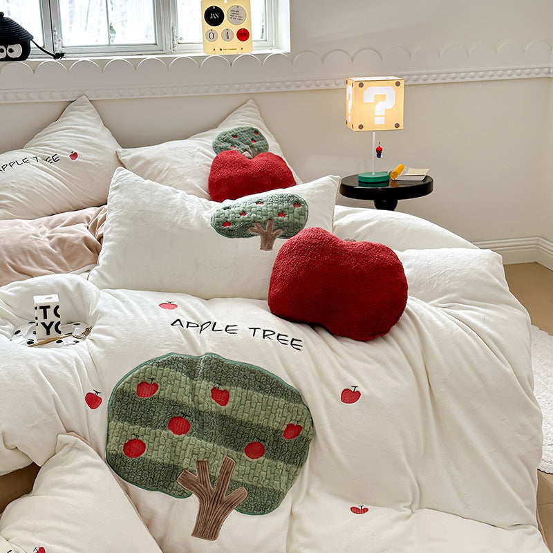 Bedding set made of soft cotton with embroidered apple tree motif and cuddly apple pillow