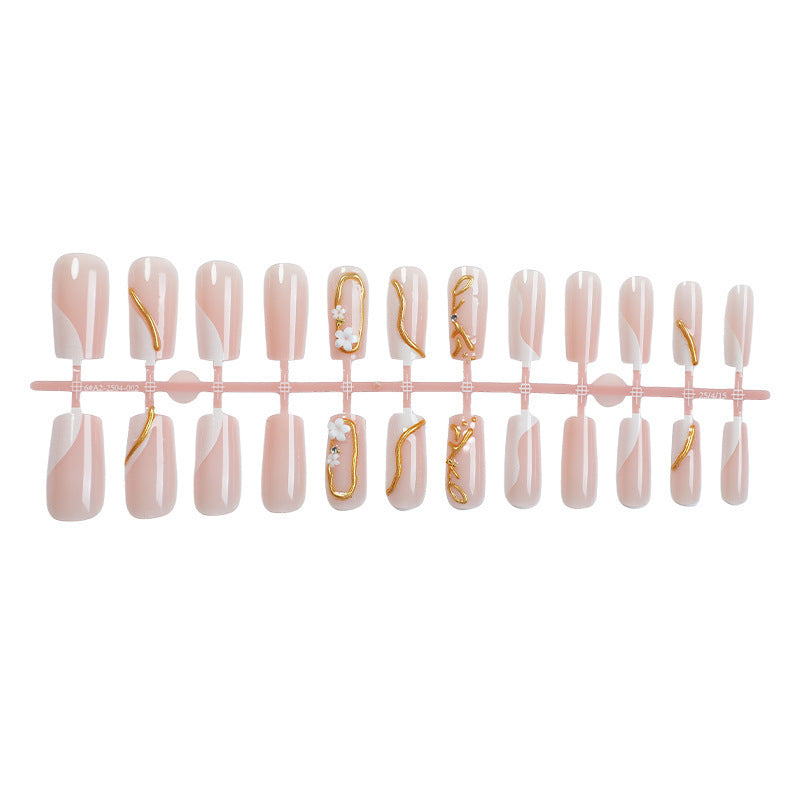 Artificial nail set with elegant gold accent and floral designs Stornfield