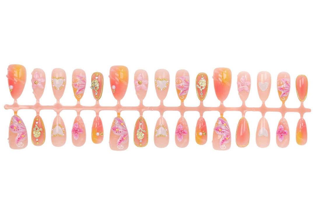 Artificial nail set with elegant floral decorations and glitter details Stornfield