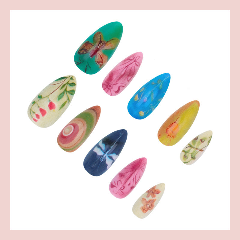 Nail art set with creative hand-painted designs and elegant details Stornfield