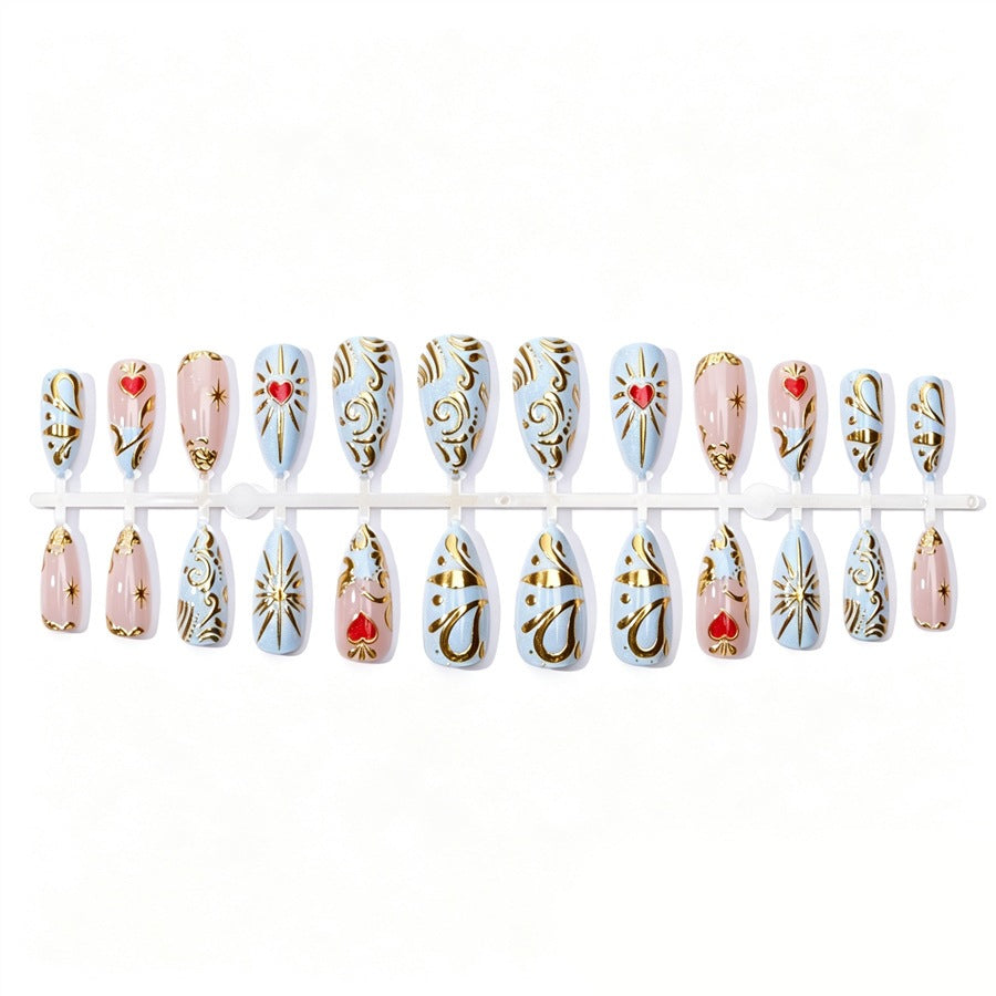 Artificial nail set with filigree golden accents and romantic heart motifs Stornfield