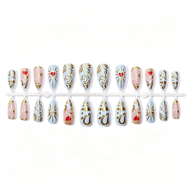 Artificial nail set with filigree golden accents and romantic heart motifs Stornfield