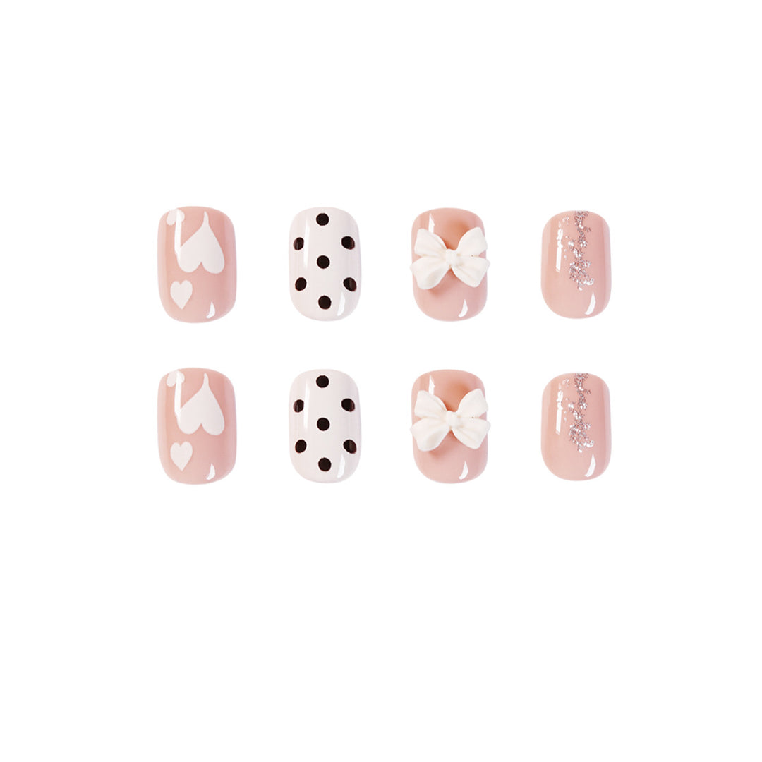Artful nail art with delicate flower and heart motifs Stornfield