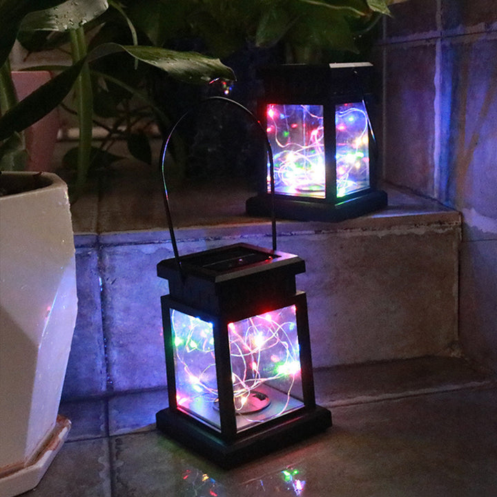 Outdoor Hanging LED Faux-Candle Glass-Pane Solar Lantern Stornfield