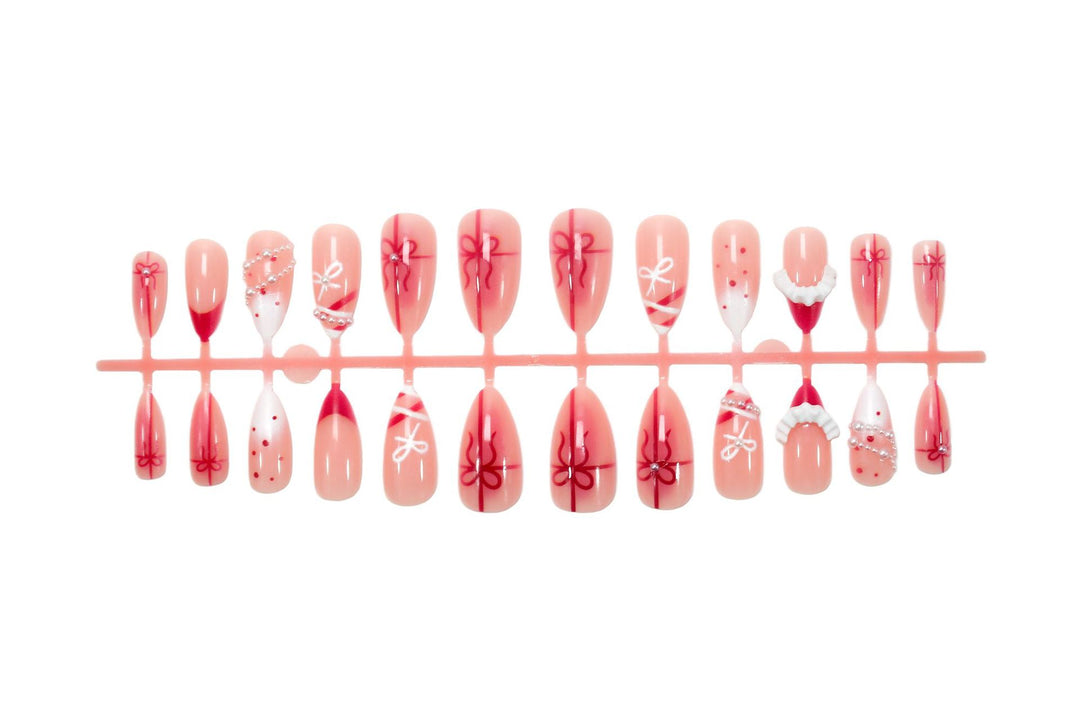Nail set with glamorous bows and elegant pearl embellishments Stornfield