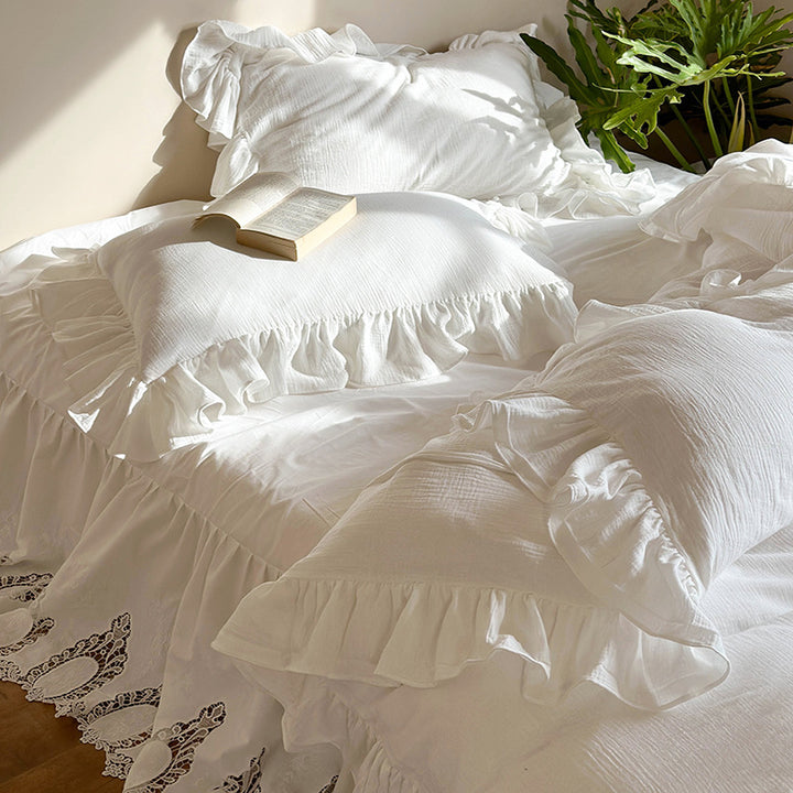 Romantic bedding set with voluminous ruffle, lace bed skirt, and double-layered frills