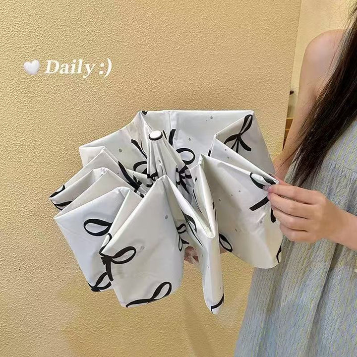 Women's foldable umbrella with elegant bow design Stornfield