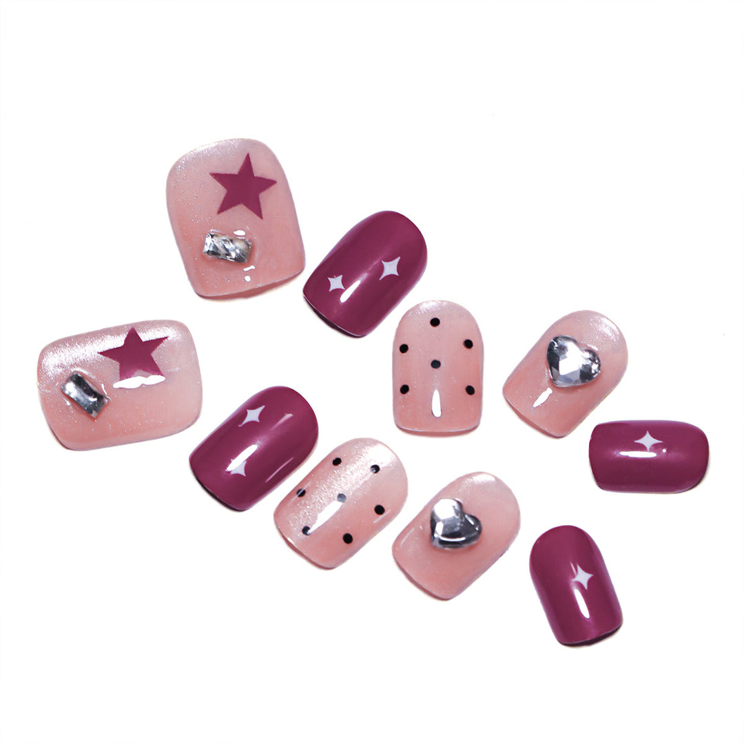 Artificial nail extensions with unique jewelry accents Stornfield