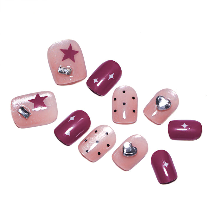 Artificial nail extensions with unique jewelry accents Stornfield