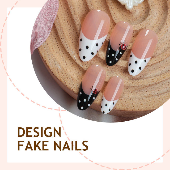 Acrylic nail set with polka-dotted accents and sparkling details Stornfield