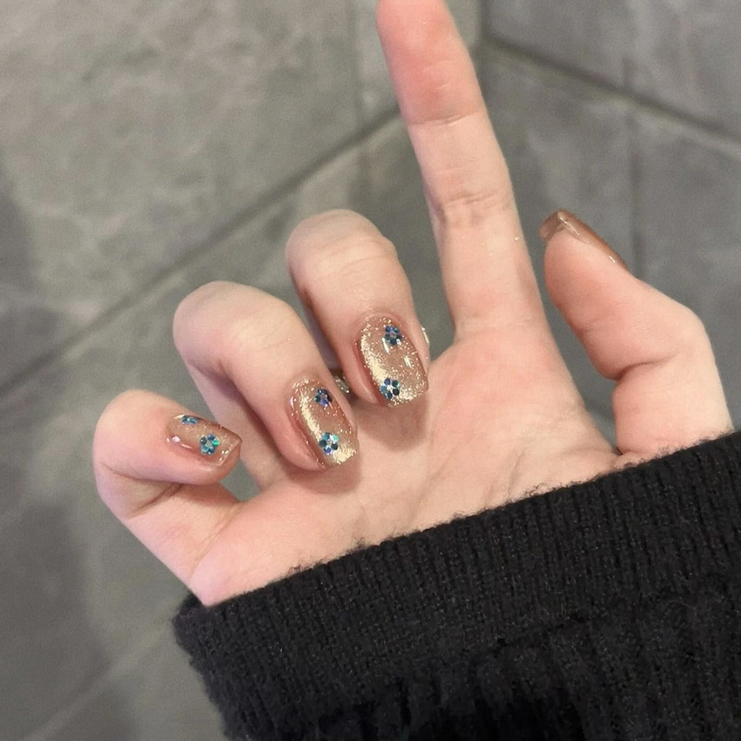 Glittering artificial nails with floral design Stornfield
